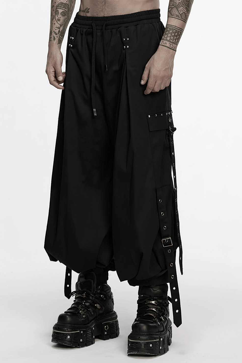 Black gothic cargo pants showing drawstring waist and rivet decoration details