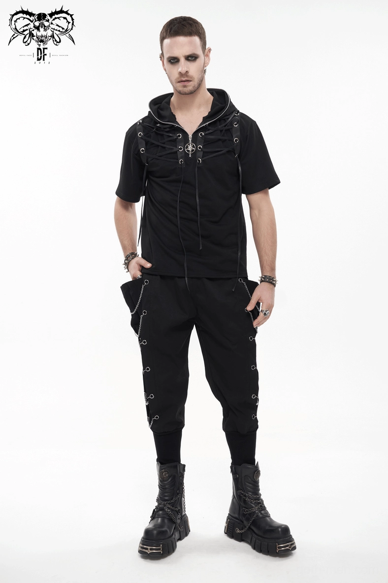 Close-up of metal eyelet and chain link detail demonstrating craftsmanship on gothic cargo pants