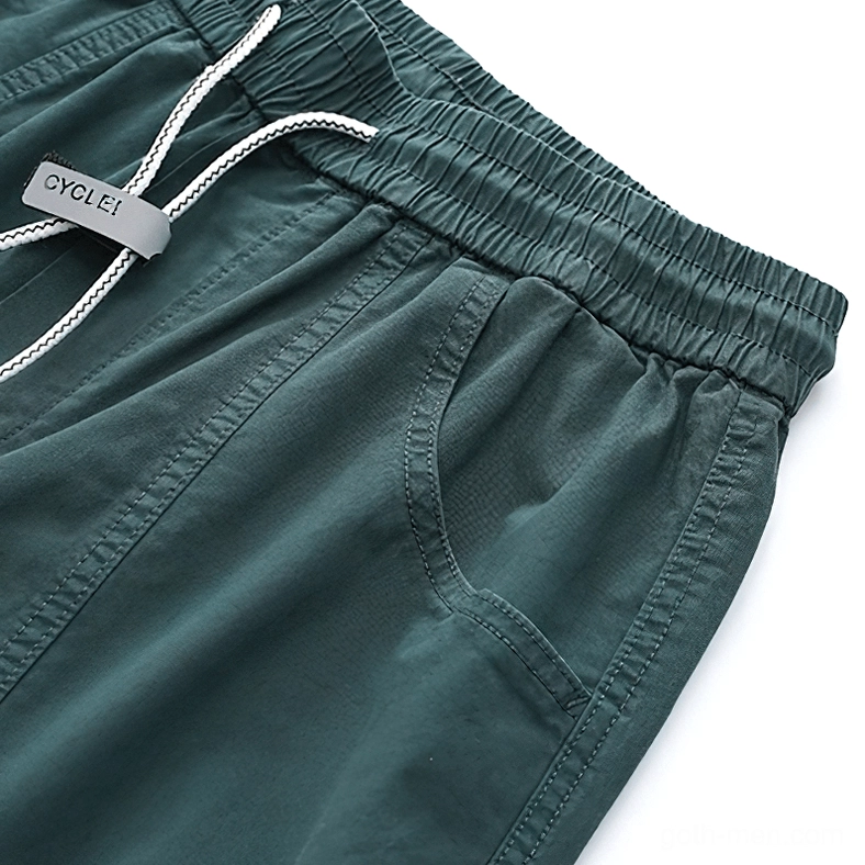 Gothic harem cargo pants fabric texture and weave close-up detail showing cotton-spandex blend quality