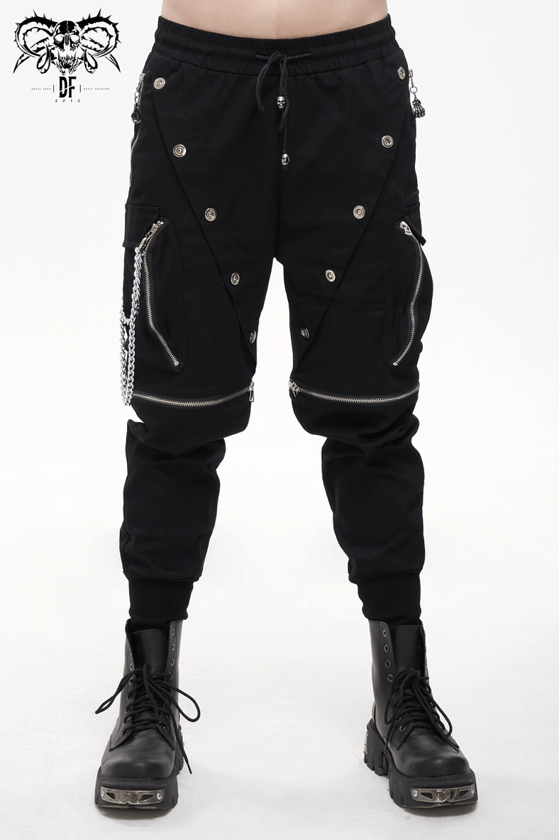 Overhead flat lay of black gothic cargo pants showing overall construction and detachable chain system
