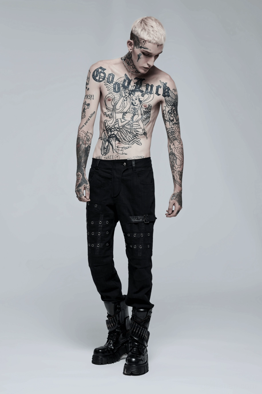 Full product presentation of black gothic cargo pants on model showcasing complete silhouette and proportions