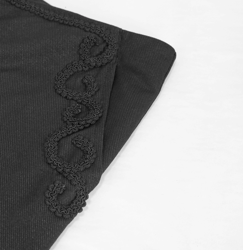 Detailed close-up of lace-embroidered side pocket on black gothic cargo pants