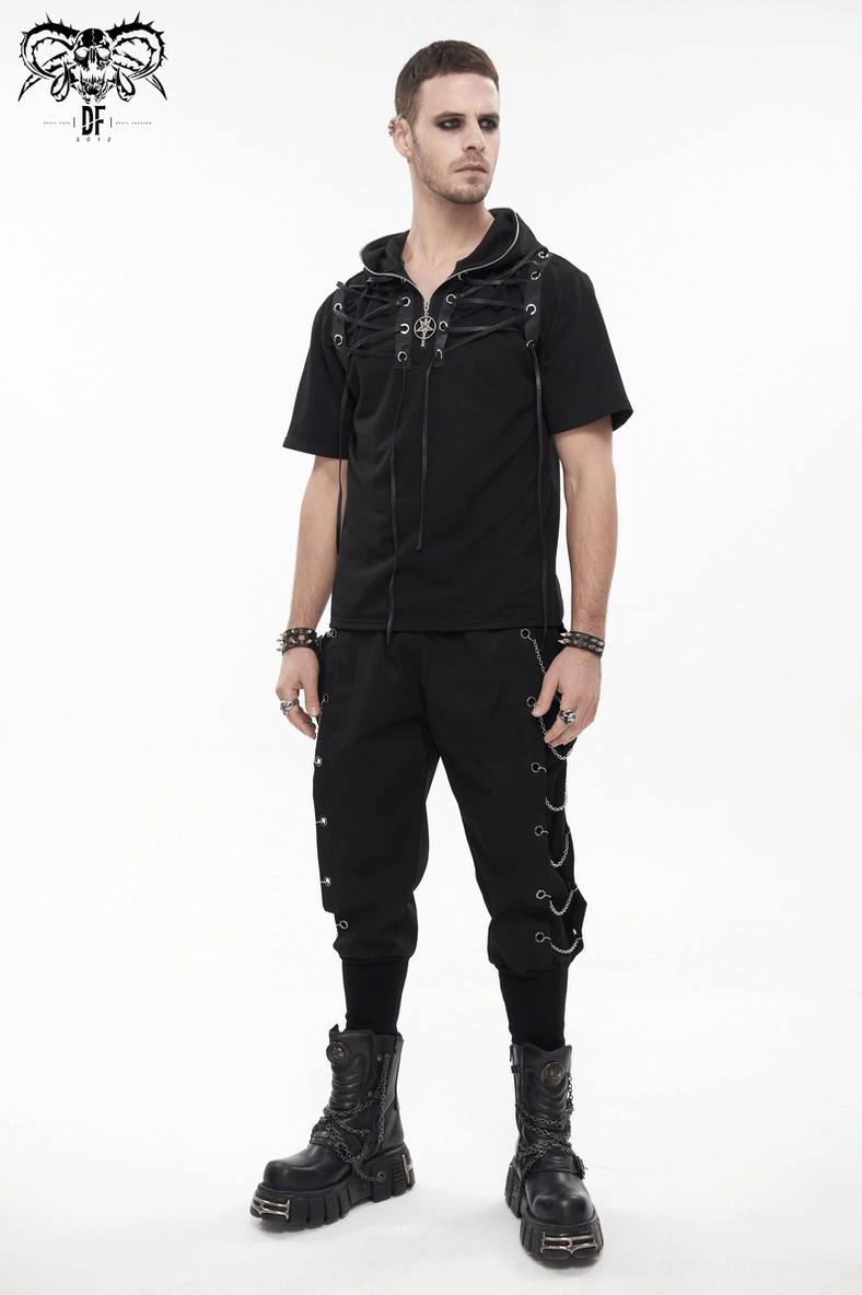 Bottom leg and cuff detail of black gothic cargo pants showing tapered design and chain trim