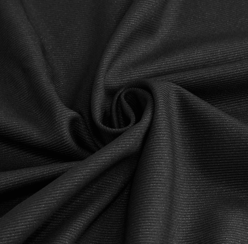 Angled view of black gothic lace cargo pants showing leg opening and tapered silhouette