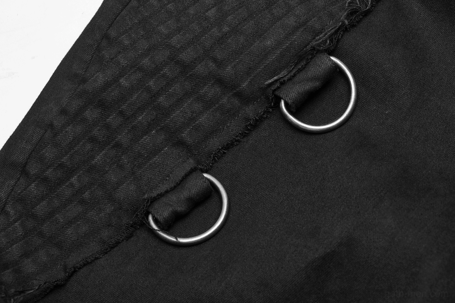 Close-up detail of metal D-rings and textured woven fabric on Gothic cargo pants
