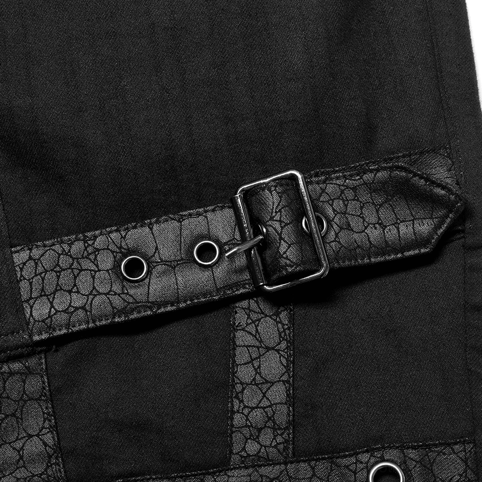 Detailed view of industrial metal grommets and hardware on black gothic cargo pants straps