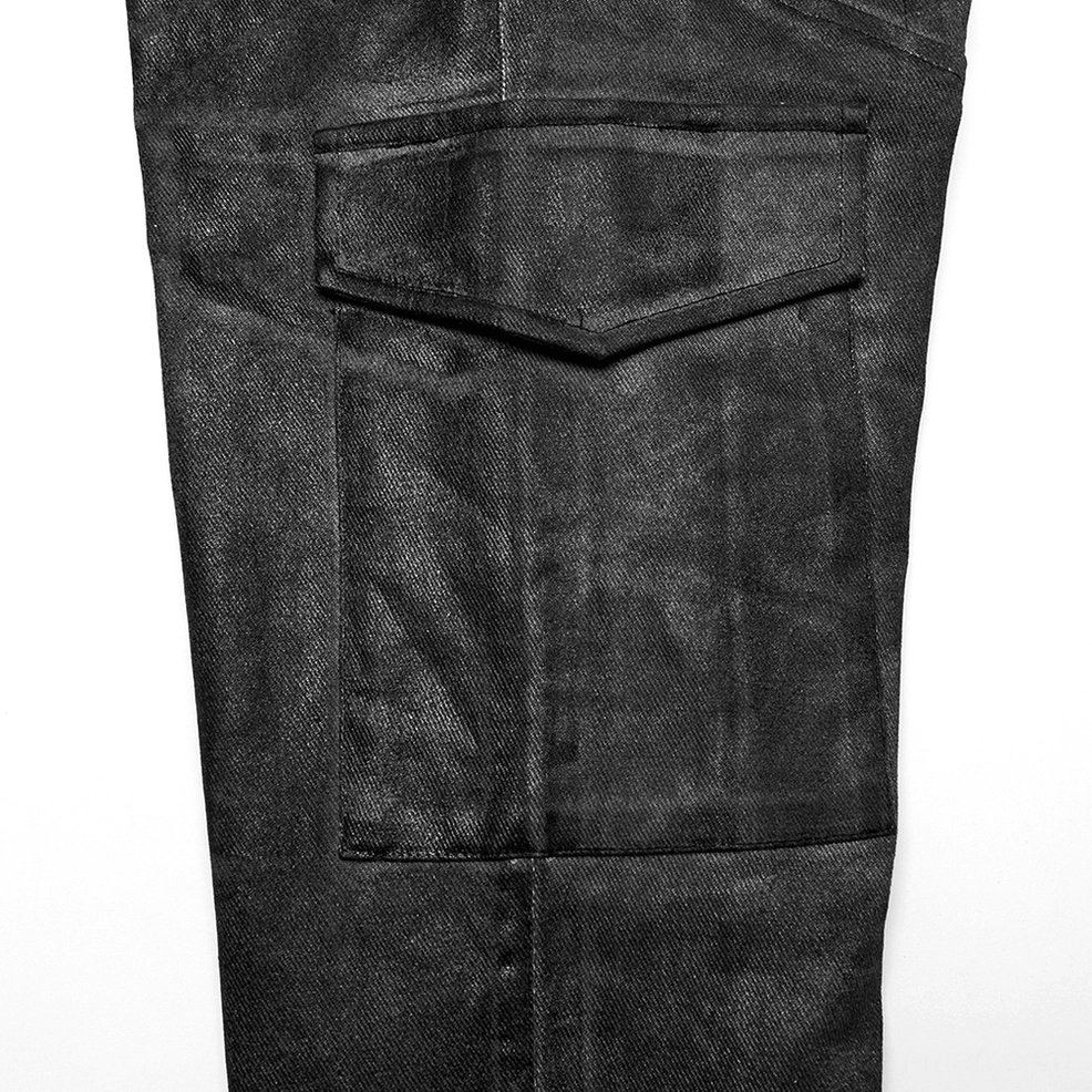 Detailed macro shot of reinforced cargo pocket flap on gothic pants showing precision stitching and fold construction