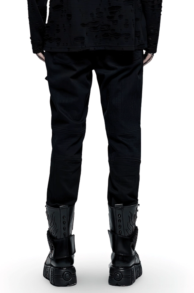 Rear view of black gothic punk cargo pants on male model with platform boots showcasing minimalist back design