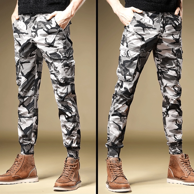 Light gray camouflage slim-fit cargo pants side-front view showing side cargo pockets and tapered legs
