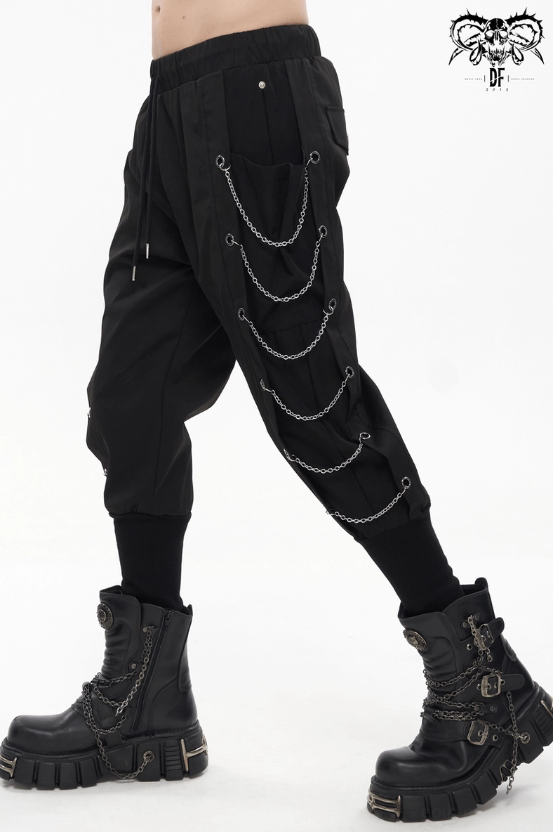 Side pocket detail of black gothic cargo pants with flap closure and structural stitching