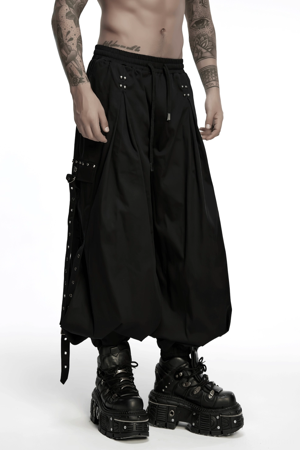 Black gothic cargo pants styled on model with alternative fashion accessories and boots