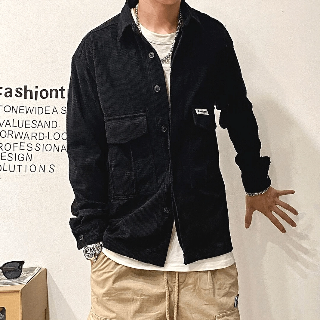 Oversized gothic cargo shirt on male model displaying full silhouette, oversized proportions, and sleeve length characteristic of contemporary goth fashion