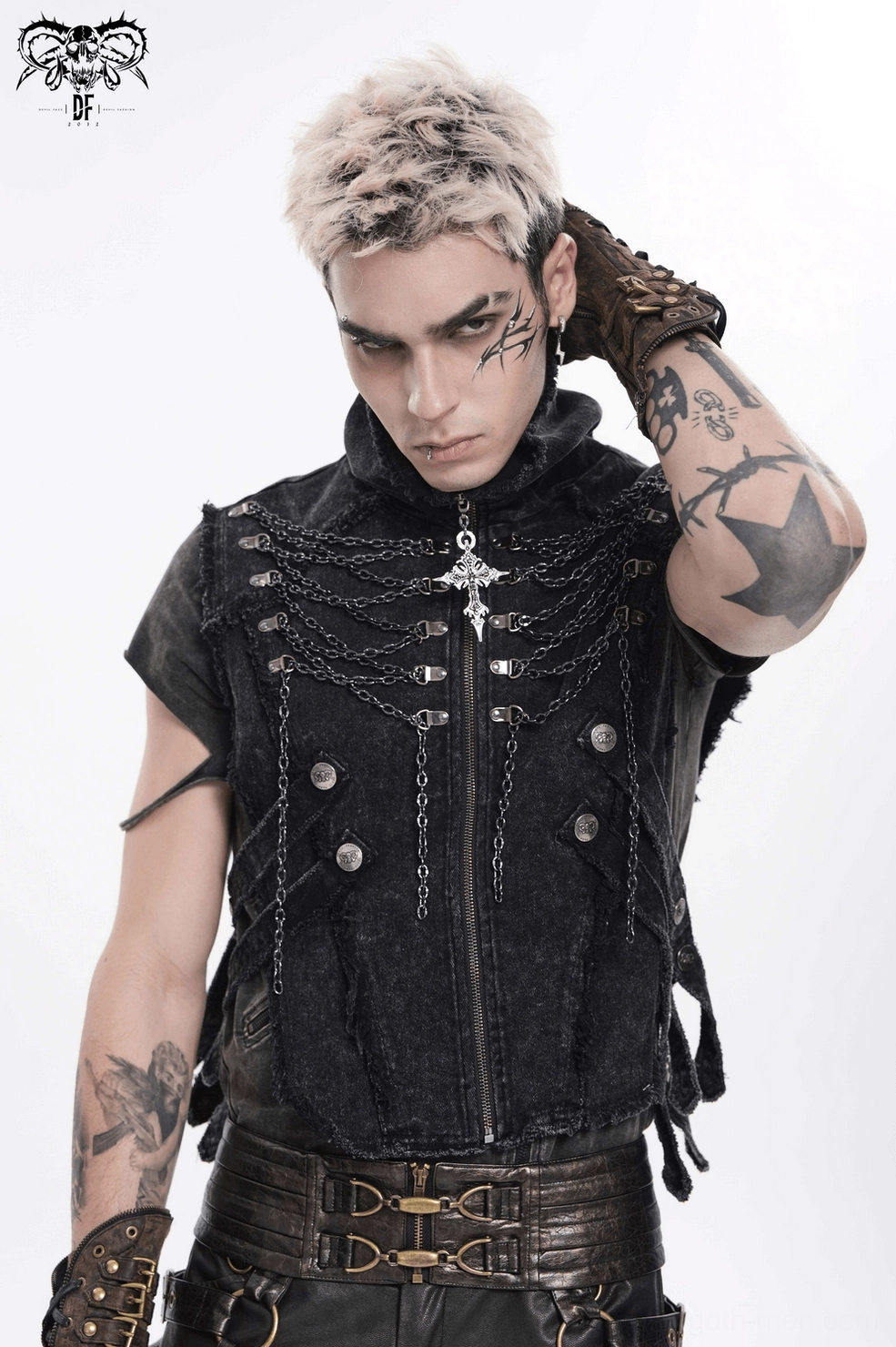 Black gothic chain vest styled with alternative fashion accessories and worn on male model in dark setting