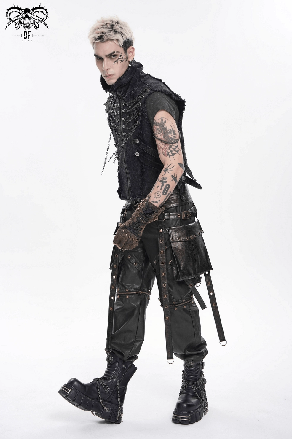 Detail view of distressed frayed edges and chain layering on black gothic chain vest