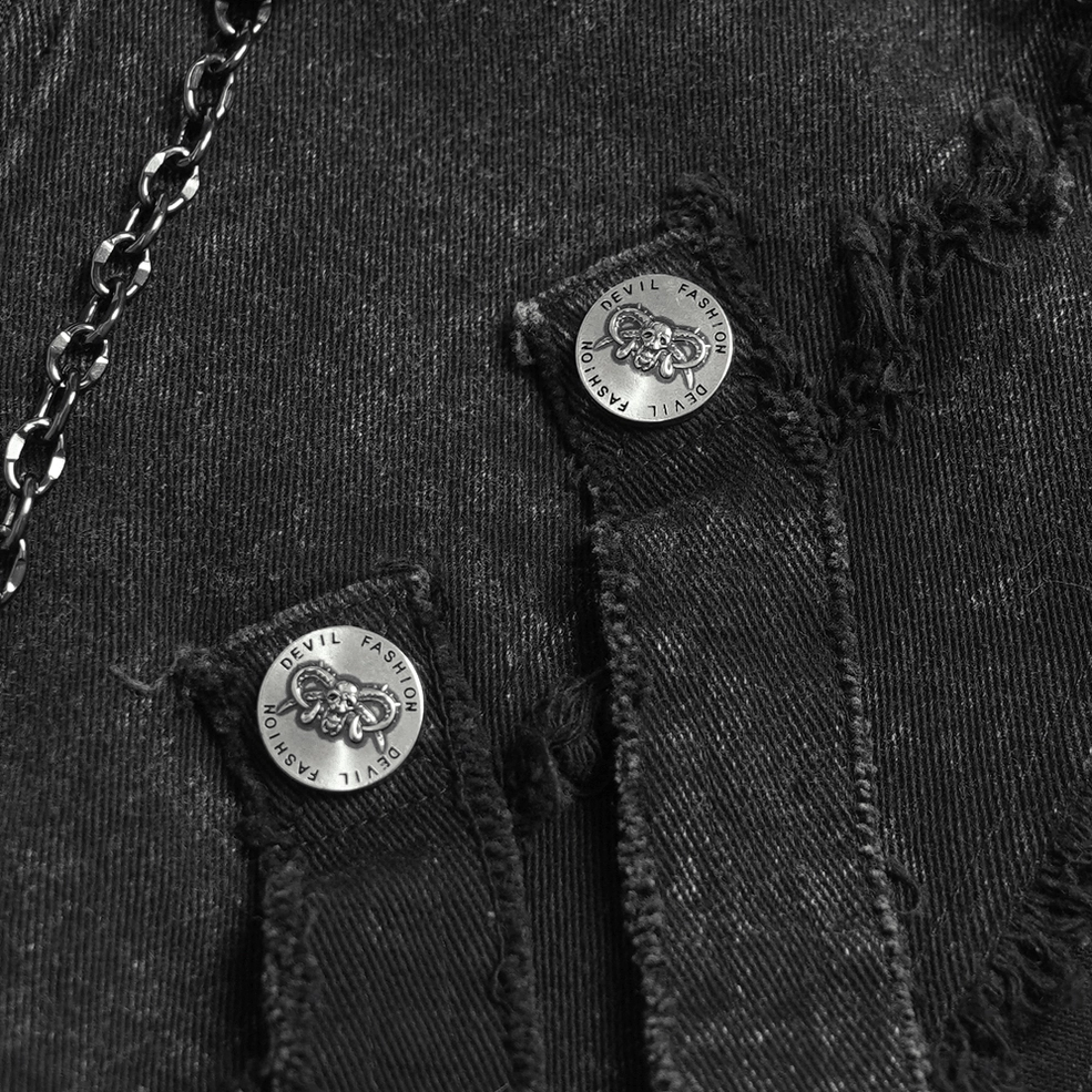 Detail shot of front zipper closure and cross zipper pull on black gothic chain vest with chain layering