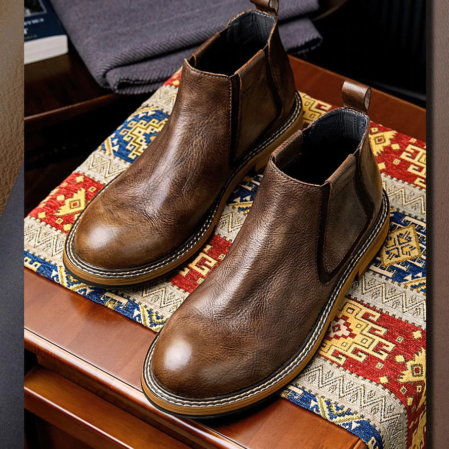 Men's black leather Chelsea boots three-quarter view, alternative fashion footwear design