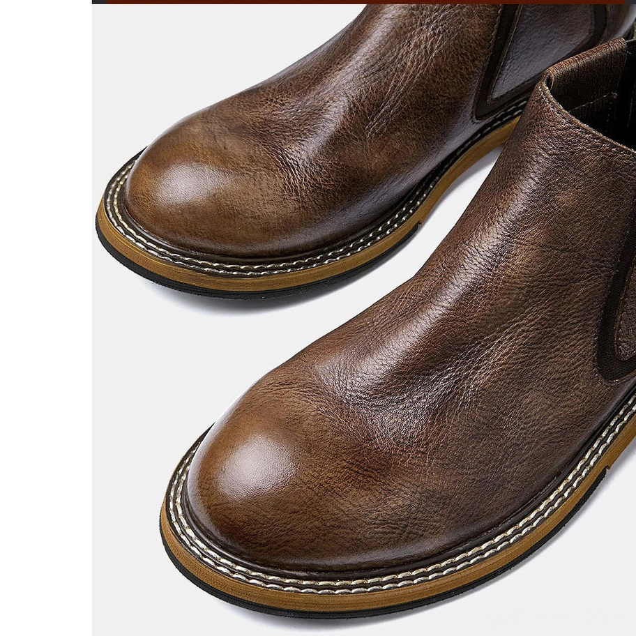 Black leather Chelsea boot construction detail, stitched ankle seam and elastic panel technology