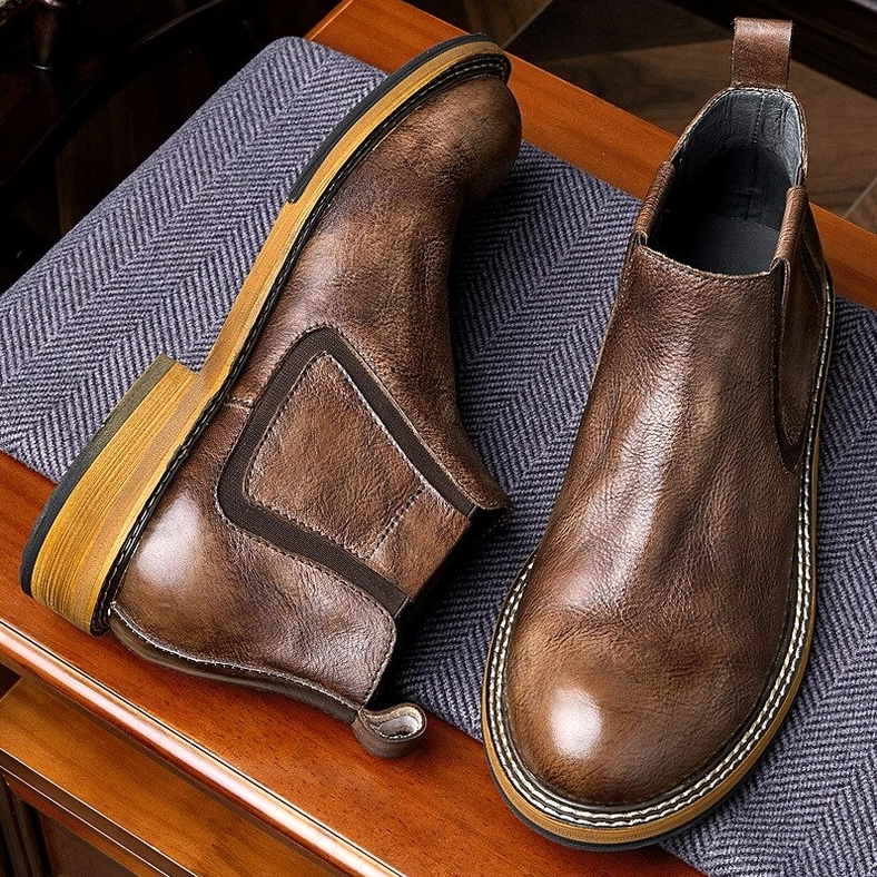Distressed brown leather Chelsea boots weathered patina, vintage gothic boot aesthetic