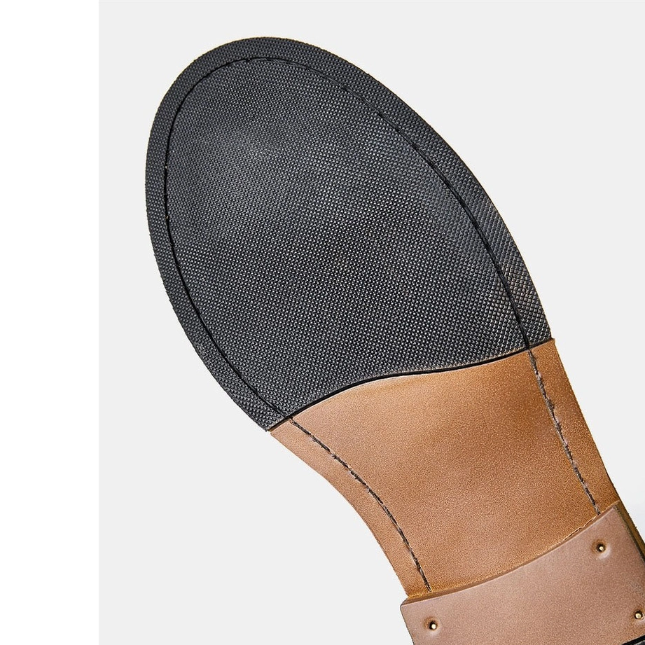 Genuine leather texture detail of gothic Chelsea boots, cow leather upper material quality