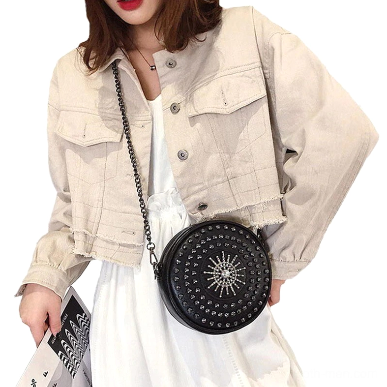 Woman wearing black gothic studded crossbody bag with denim jacket in casual daily style, front view