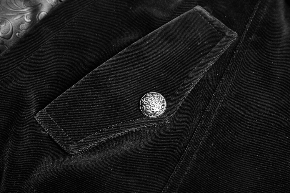 Carved metal button and velvet fabric flap detail close-up of gothic cloak showing construction quality