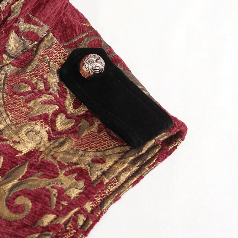 Close-up detail of gothic coat shoulder strap featuring black velvet material with vintage silver metal button, showing construction quality