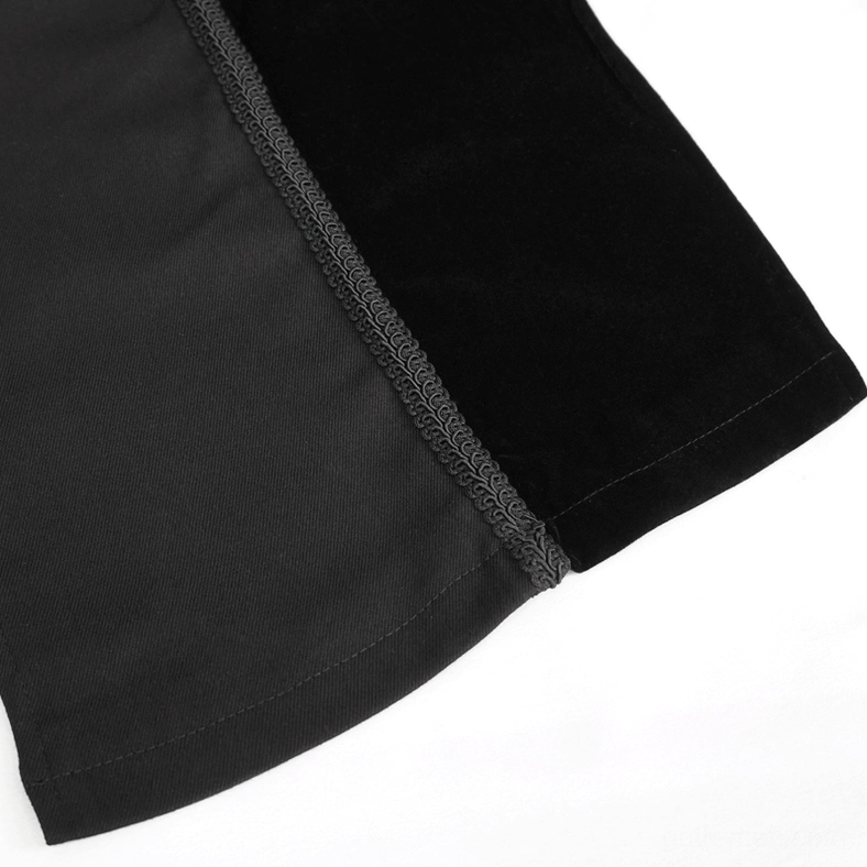 Gothic coat side seam close-up with embroidered trim and fabric joint detail on white background