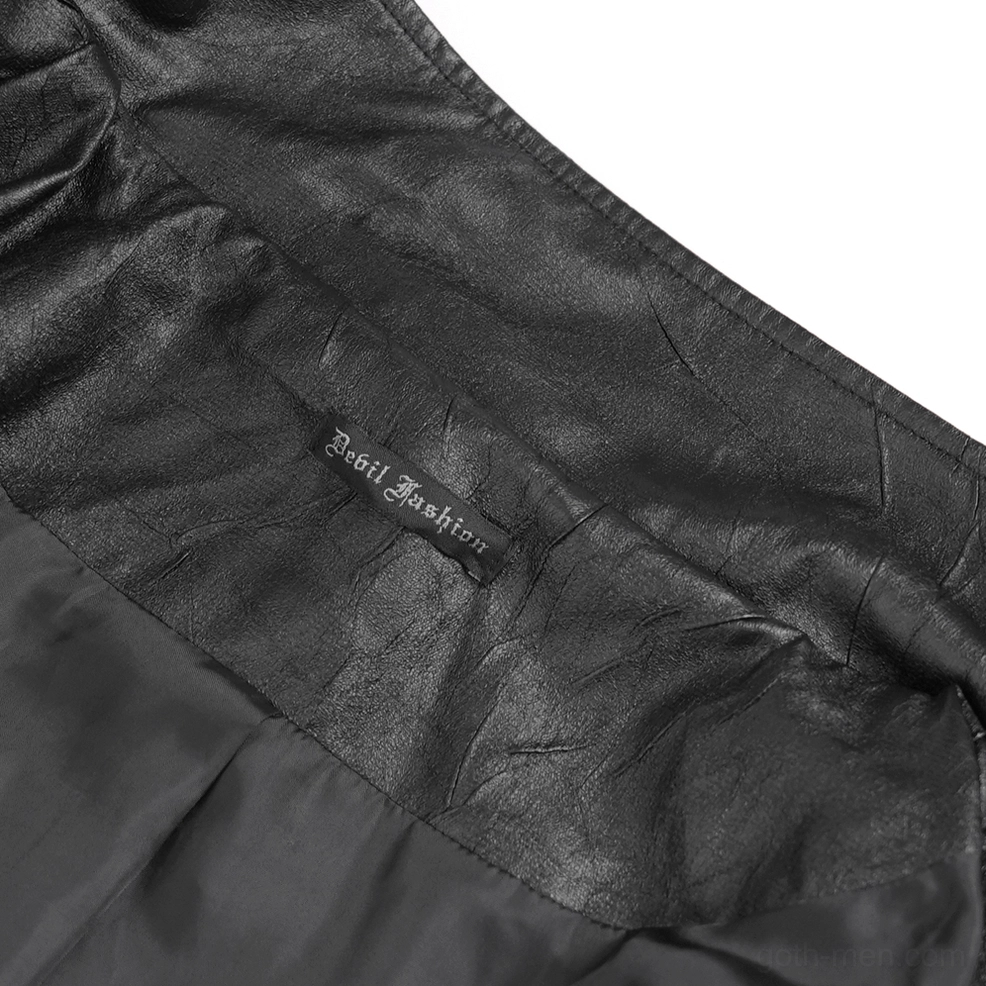 Gothic long coat sleeve cuff with metal eyelets and structured fit showing premium faux leather texture