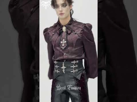 Male model full body wearing black brocade gothic waist corset with silver cross details, complete gothic outfit styling