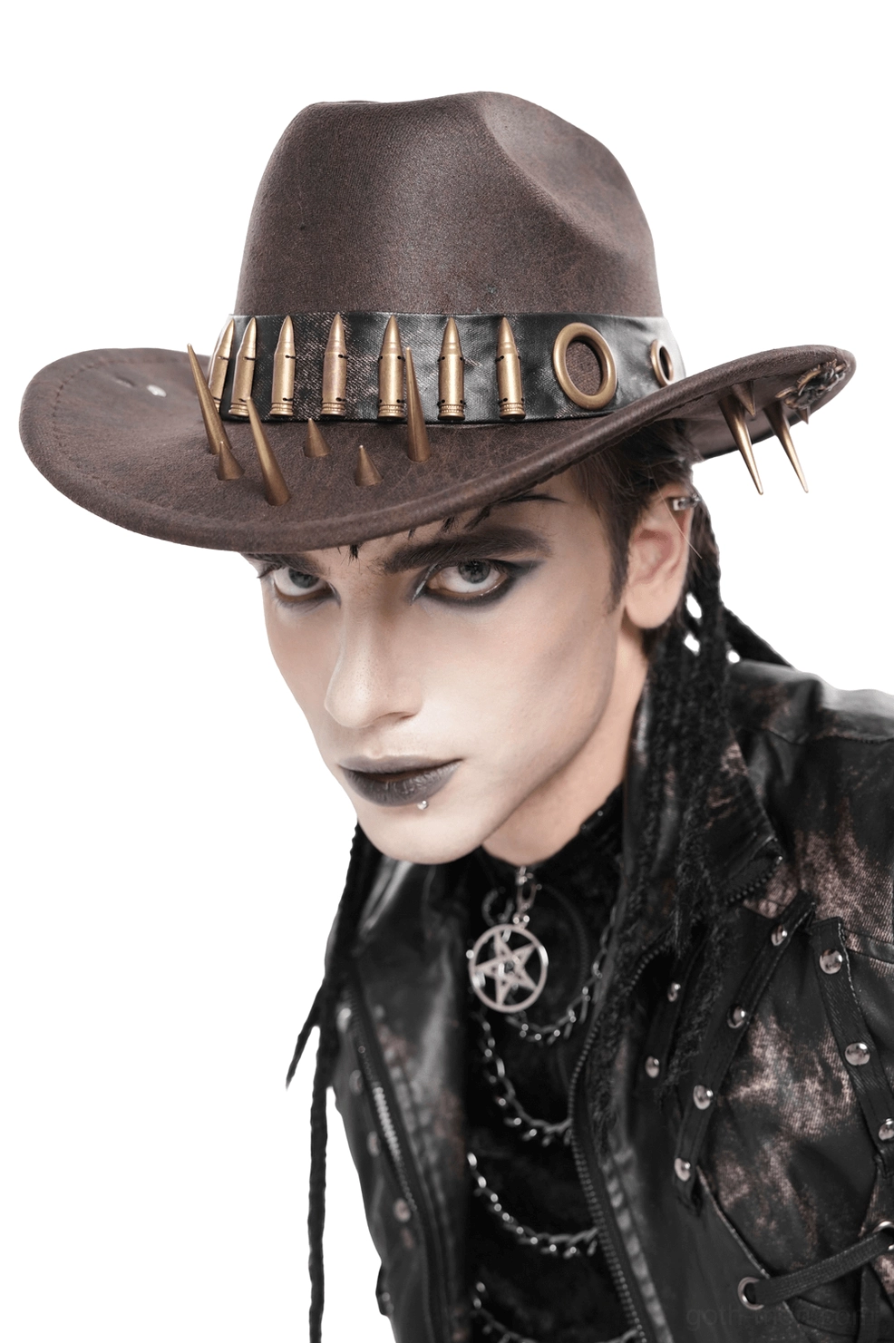 Male model wearing brown gothic cowboy hat styled with dark punk leather outfit and metal accessories, three-quarter pose