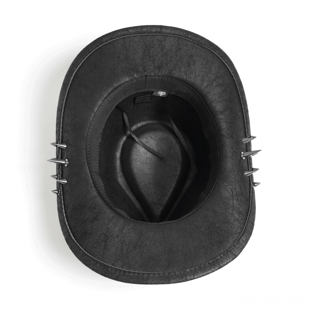Interior view of gothic cowboy hat from above showing black faux leather lining and metal spike decorations on outer brim