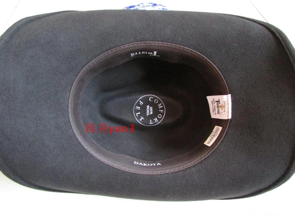 Black cowboy hat interior showing dark grey lining, brand label, and size tags