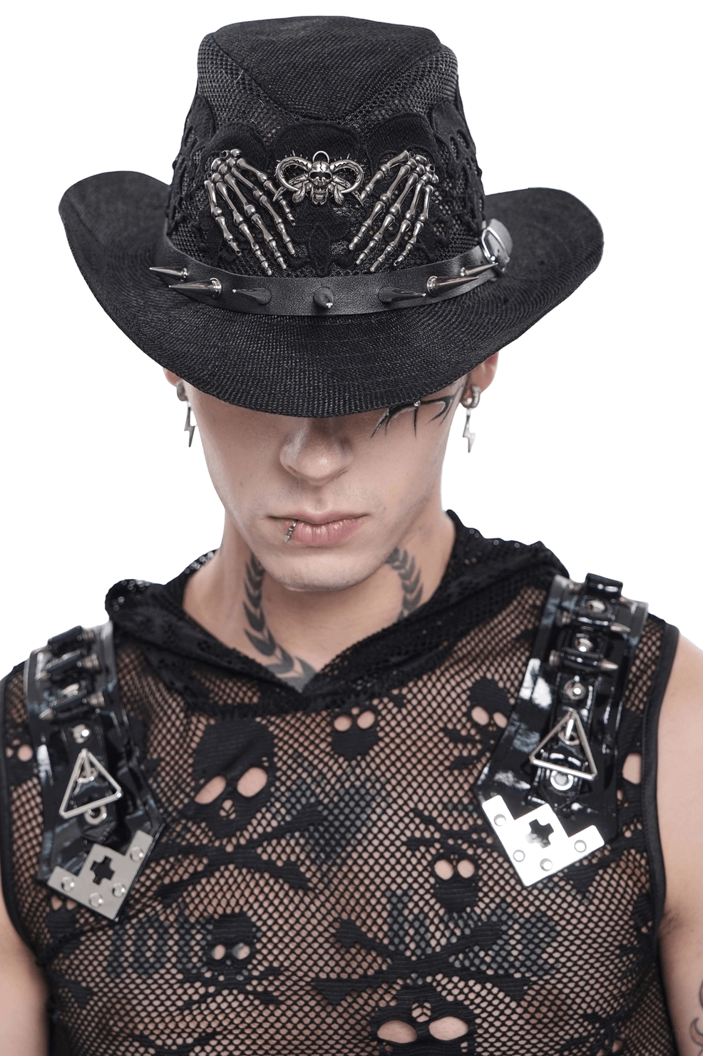Skull lace gothic cowboy hat with skeleton hand appliqués and metal spike trim, front view on tattooed male model