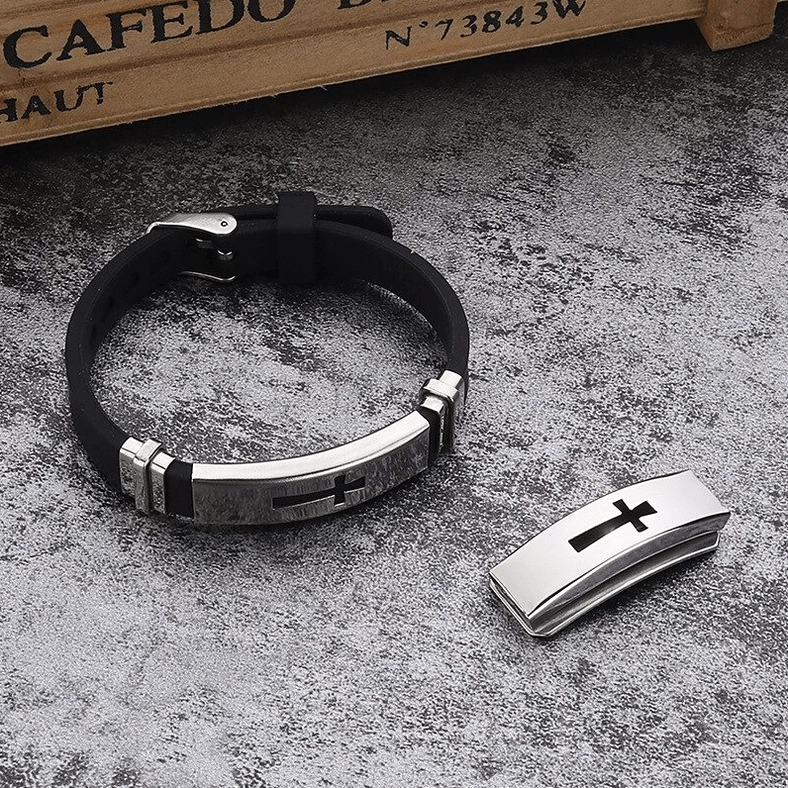 Single gothic cross silicone bracelet with brushed silver metal accent and spare cross plate on wooden vintage box