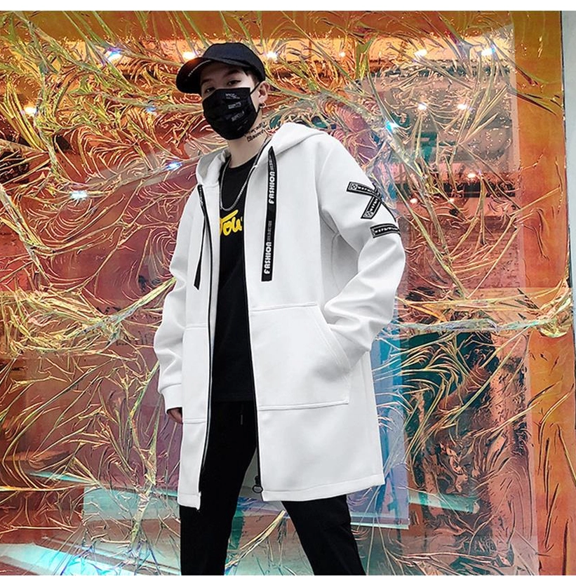 Black men's gothic hooded zip coat with hood up, side profile view indoor