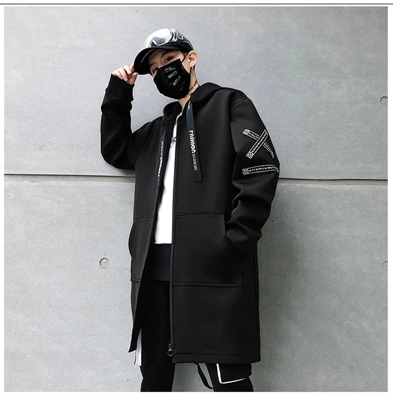Close-up of ribbed cuff detail on black gothic hooded coat sleeve