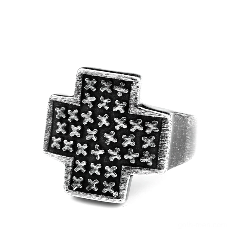 Polished silver gothic cross ring with dense cross pattern engravings, front three-quarter view showing bright metallic finish