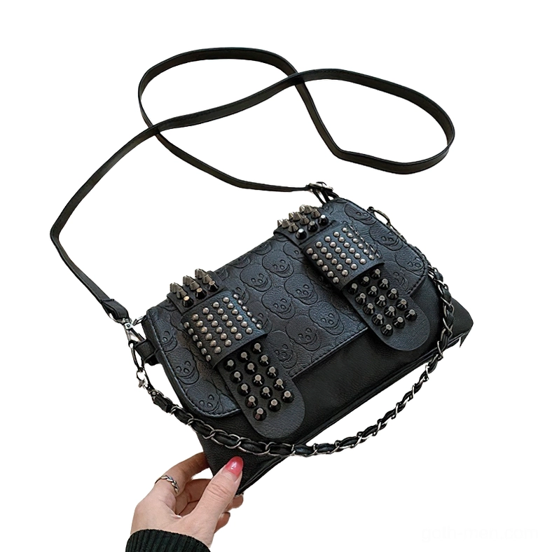 Gothic crossbody bag low side view showing hybrid chain and leather strap construction detail