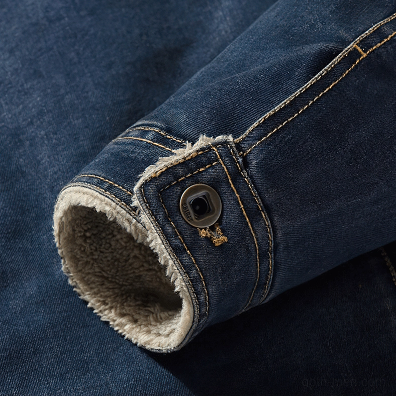 Men's gothic denim jacket sleeve cuff detail, denim fabric texture, snap button closure, shearling inner lining