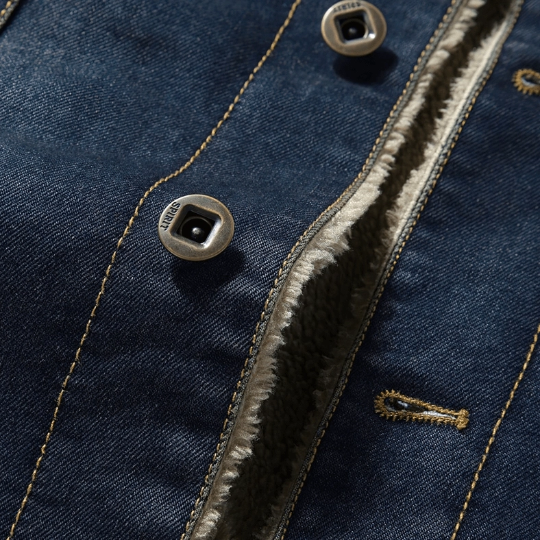 Close-up of men's gothic denim jacket front placket, metal snap buttons, contrast yellow stitching, fleece lining edge detail