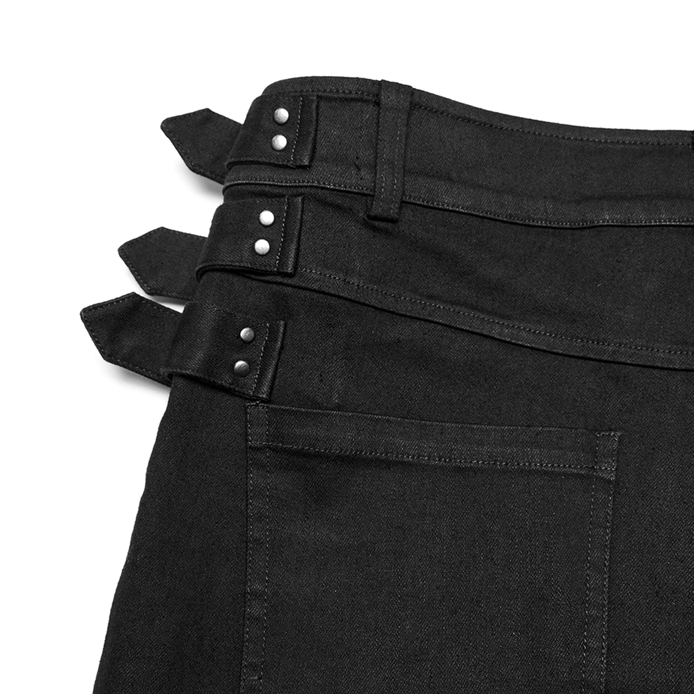 Rear waist and pocket close-up showing black denim stitching and decorative buckle attachment on gothic pants