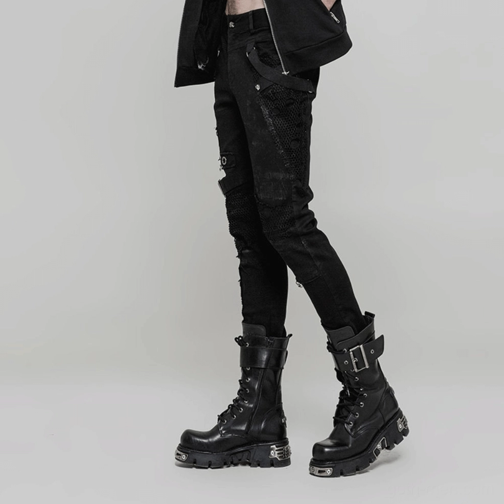 Detail view of distressed leg sections and mesh fabric overlay on men's gothic black denim jeans