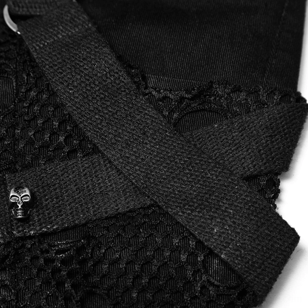 Close-up detail of skull metal buckle and webbing strap accent on gothic distressed black jeans