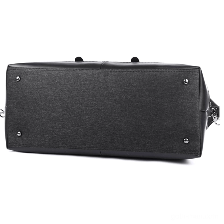 Gothic canvas duffel bag base detail showing black Oxford material with leather foundation and metal foot studs