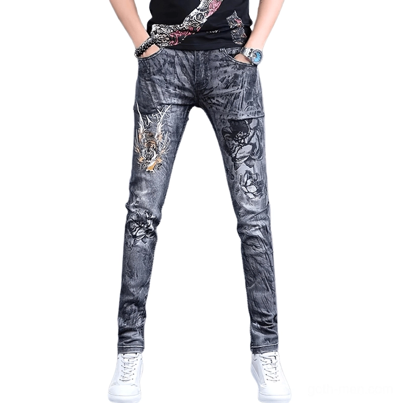 Front view of men's gothic dragon embroidered skinny jeans in grey washed denim with intricate thigh embroidery