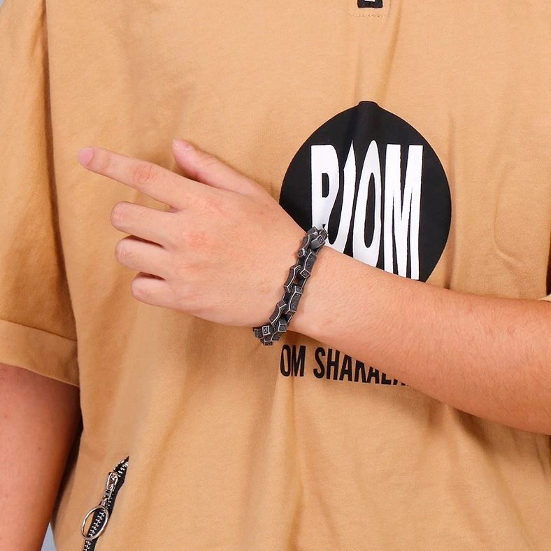 Dark engraved gothic bracelet half-body styling on man