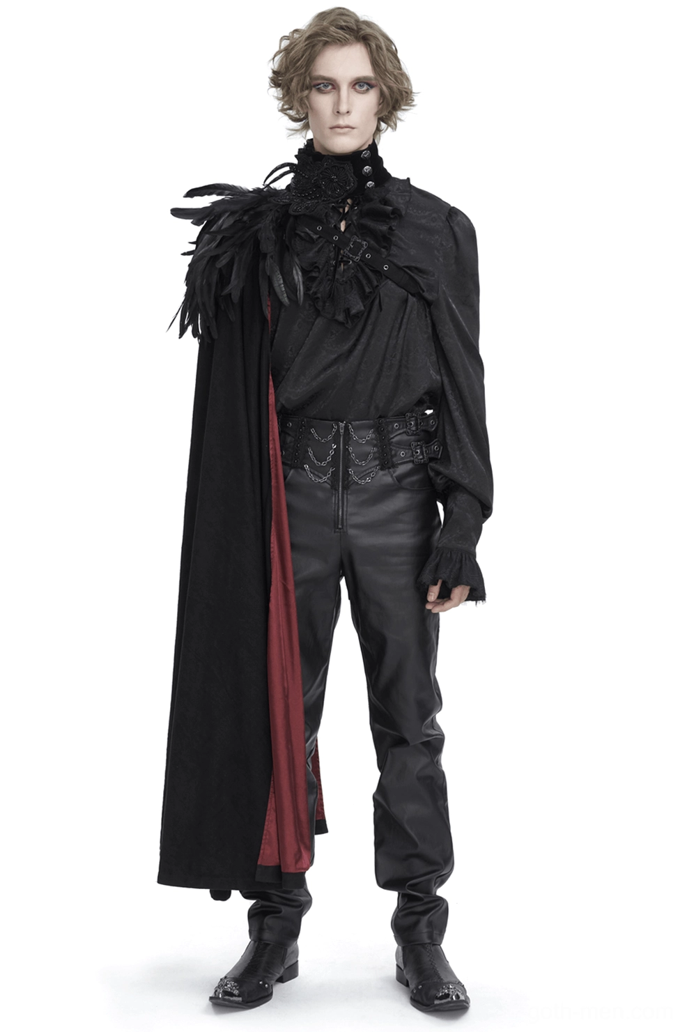 Male model wearing black feathered asymmetric gothic cape with wine-red lining, front full-body view in studio setting