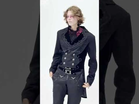 Gothic formal coat on male model with curly hair, close-up showing velvet collar and double-breasted front design details