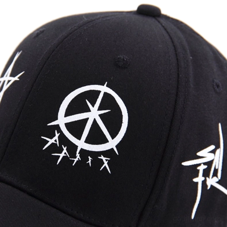 Close-up detail of gothic graffiti snapback cap showing anarchy symbol and punk letter prints texture and clarity