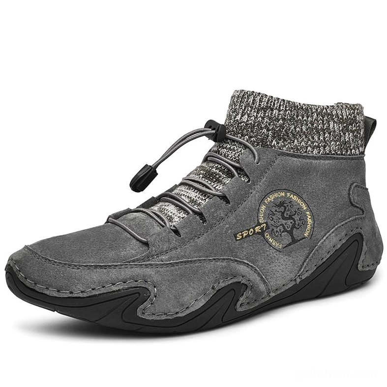 Dark grey gothic mid-top sneakers featuring toggle lacing system and suede construction - side angle